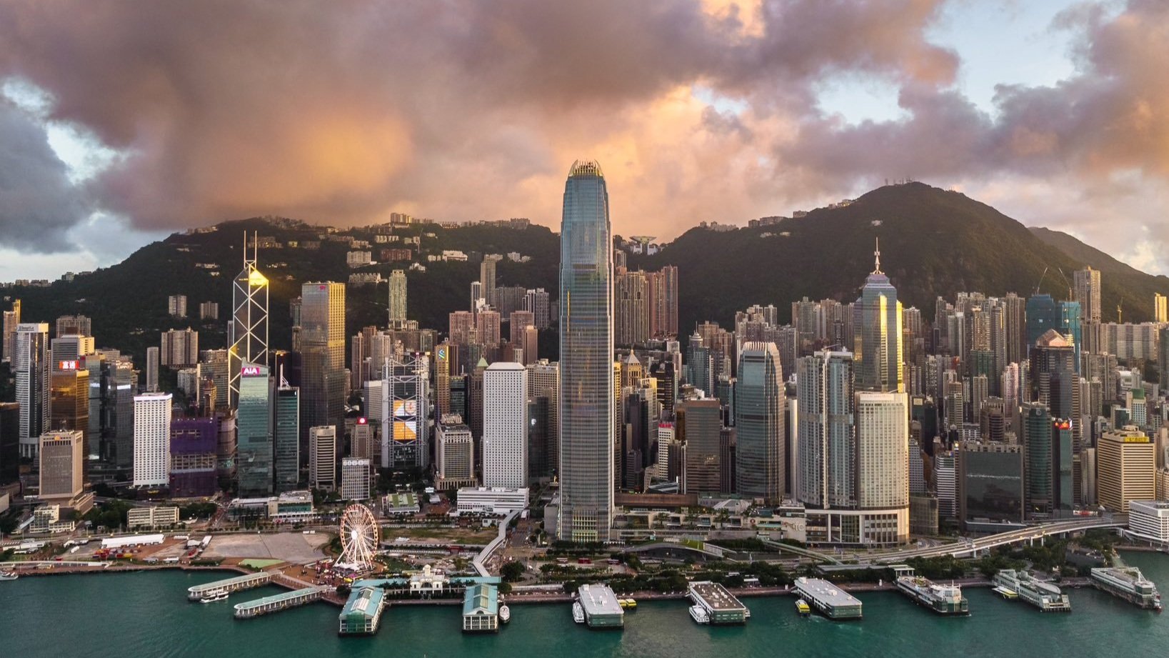 An aerial shot of the Hong Kong skyline at sunset.
