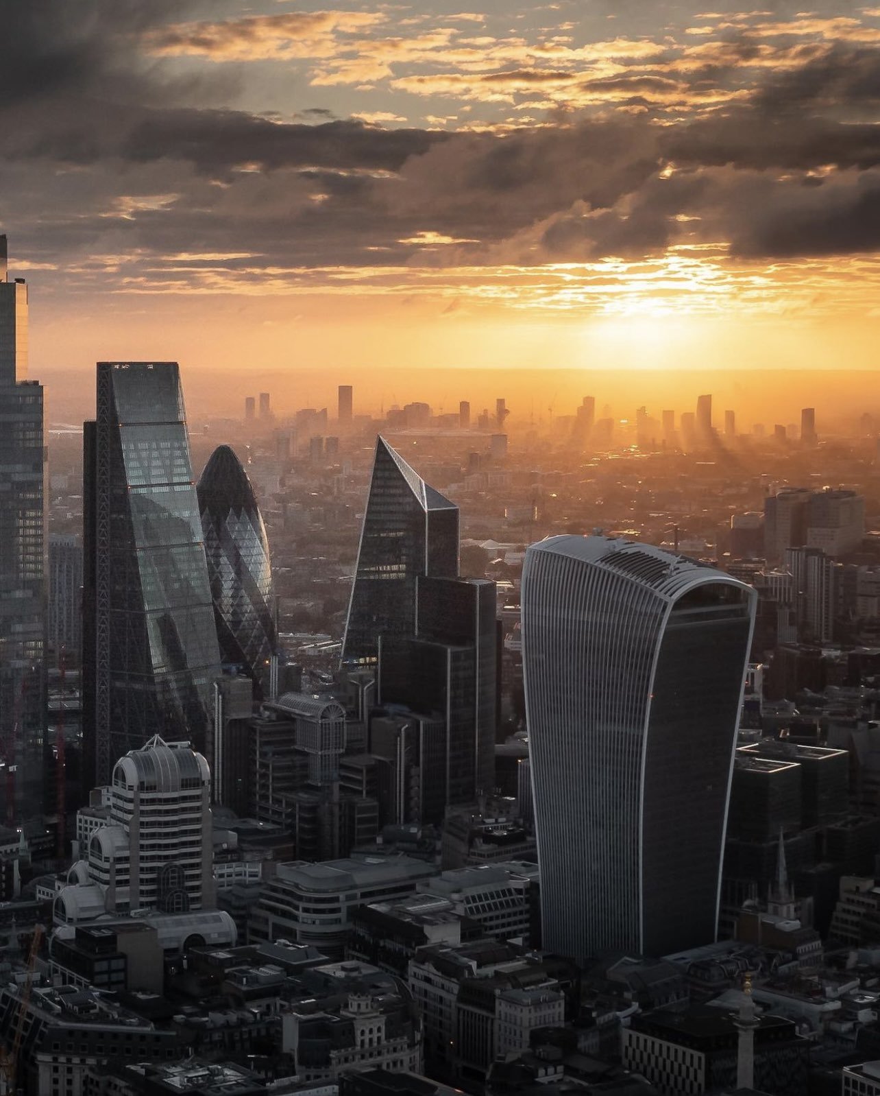 Aerial Image of London's Central Business District against the backdrop of a stunning sunset.